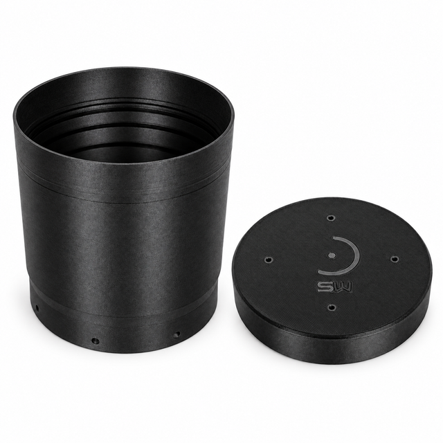 Photographic arrangement of the two included black parts: Premium dew shield with internal light-control baffles and matching dust cap.