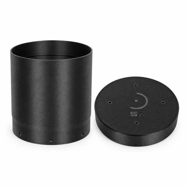 Photographic arrangement of the regular unbaffled dew shield and matching dust cap, shown separately in Black.